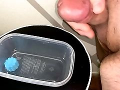 Smallish Penis Attempting To Jizm In A Plastic Pot And Piss On It